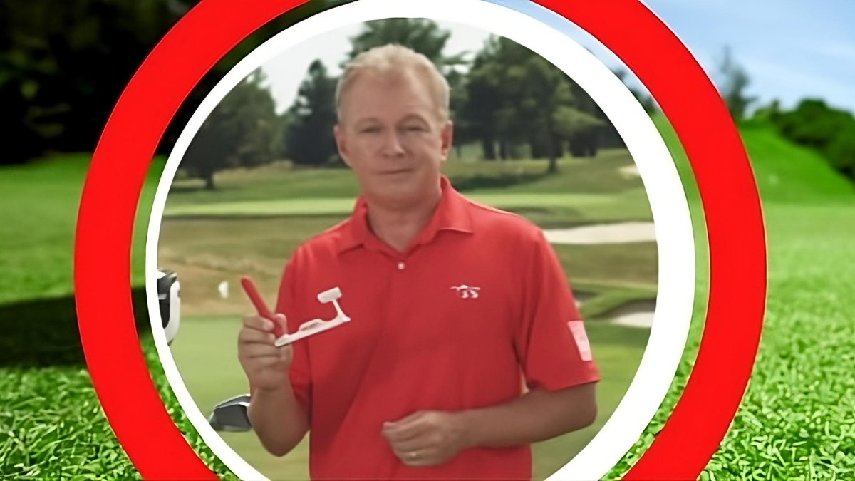 A man prepares to swing a golf club in front of a red circle, highlighting the use of a golf wrist hinge training aid.