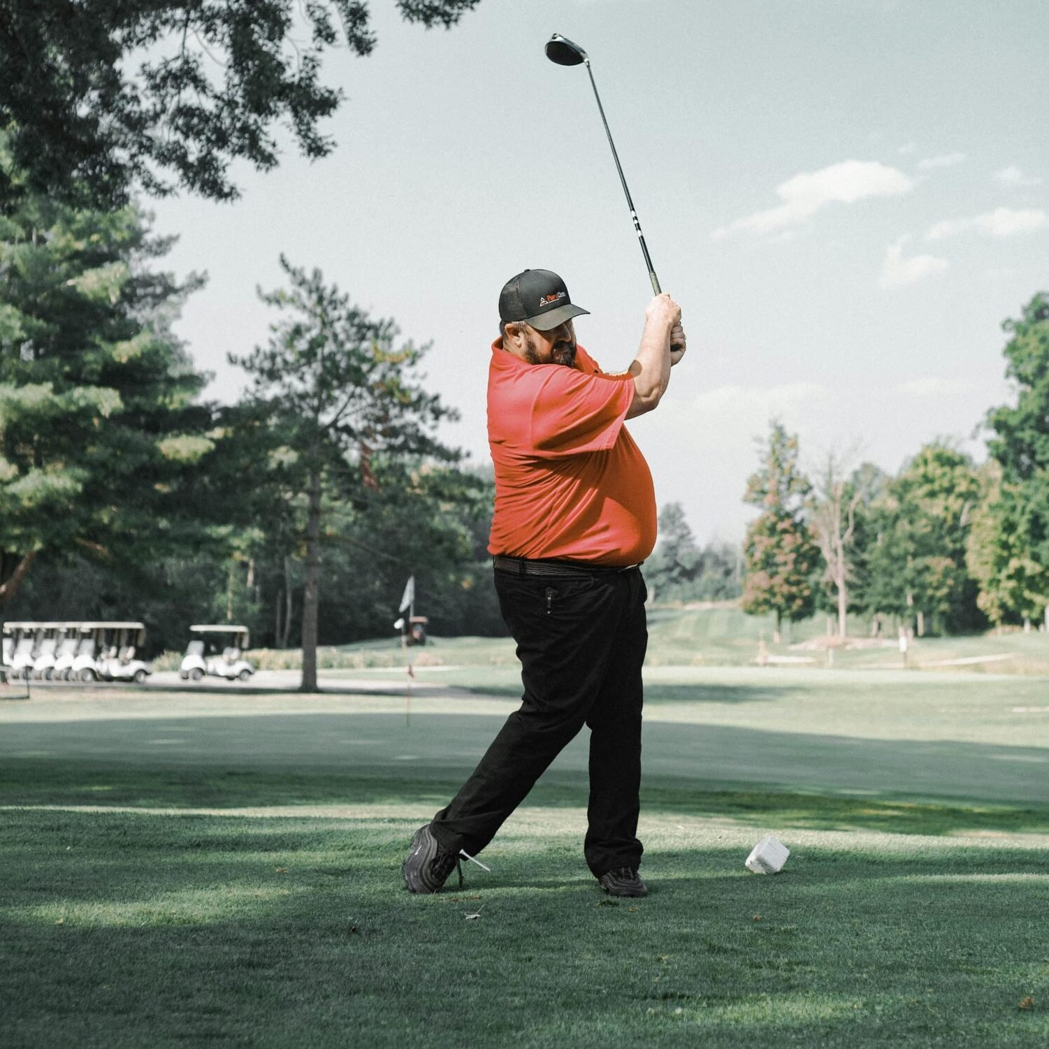 Male Golfer Swinging a Club