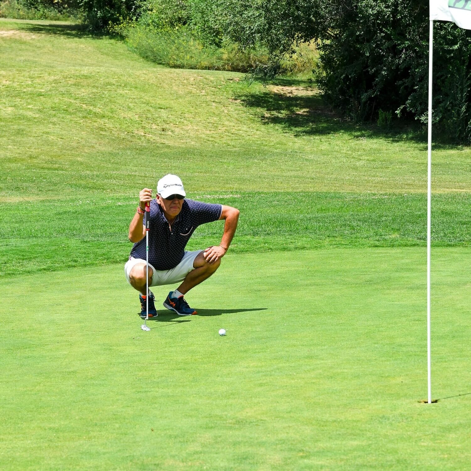 Man Playing Golf on a Field