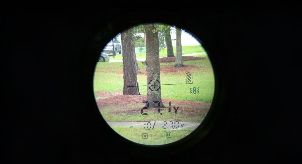View through a scope at trees